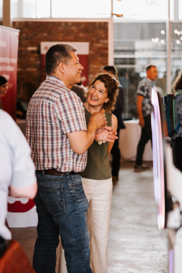 Two people talking at Canadians Connected: Edmonton