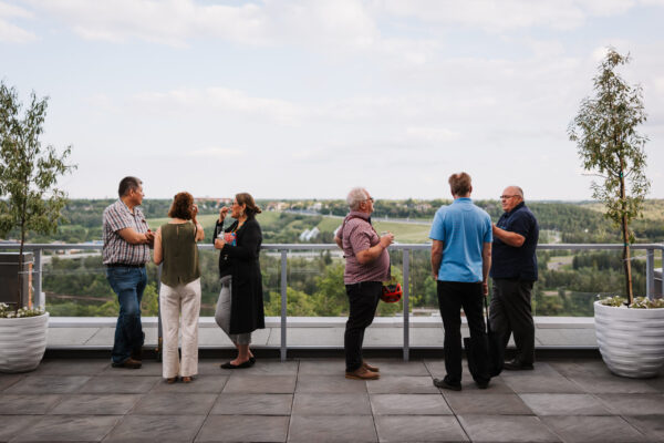 People standing on the patio at Canadians Connected: Edmonton