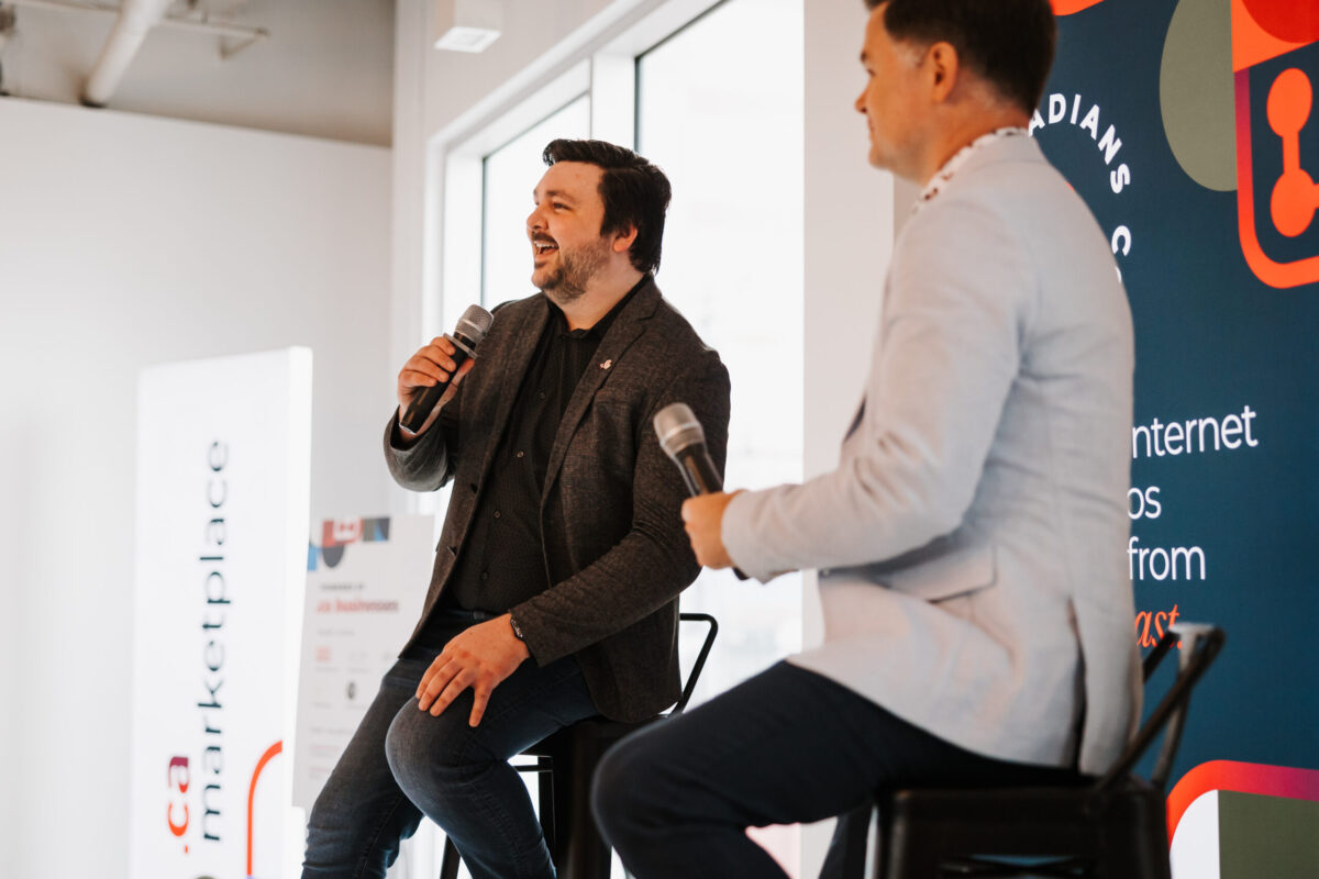 Chad Ohman and Spencer Callaghan on stage at Canadians Connected: Edmonton