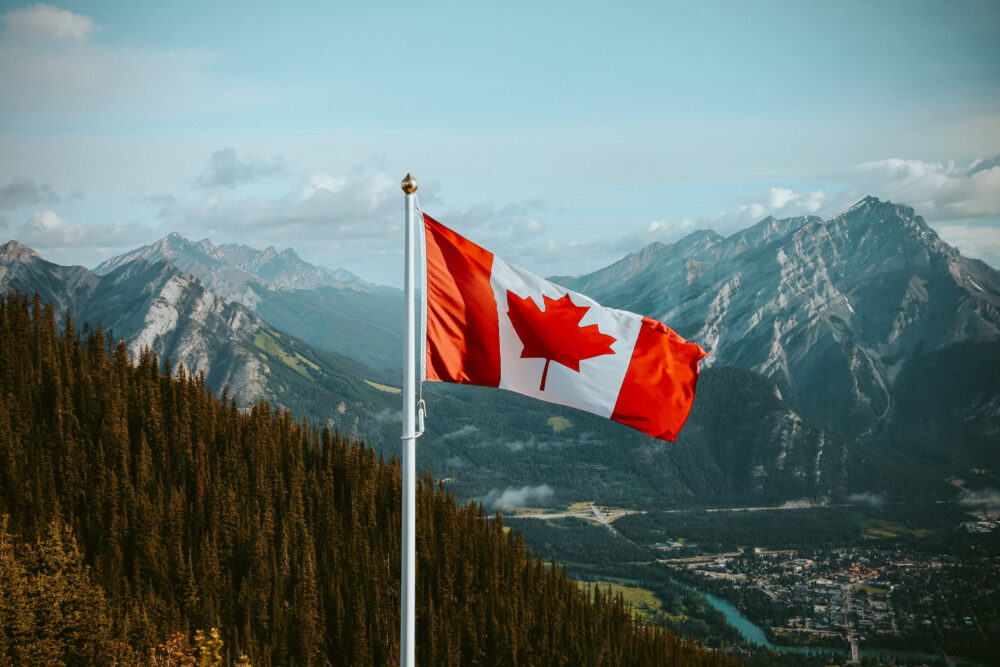Canadian Flag In The Mountains