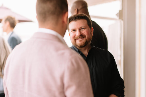 Person smiling in conversation