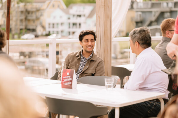 Two men chatting on a patio