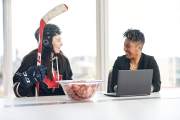 Colleagues chat over ketchup chips