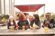 Drunk guy interrupts beer with friends