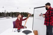 Lumberjacks debate merits of market segmentation while a spy looks on