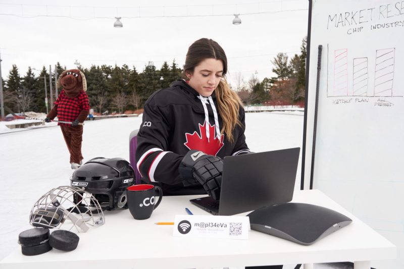 Hockey player checks the analytics as rival looks on
