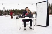 Hockey player prepares presentation while moose considers his life choices
