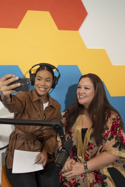 Female podcasters taking a selfie